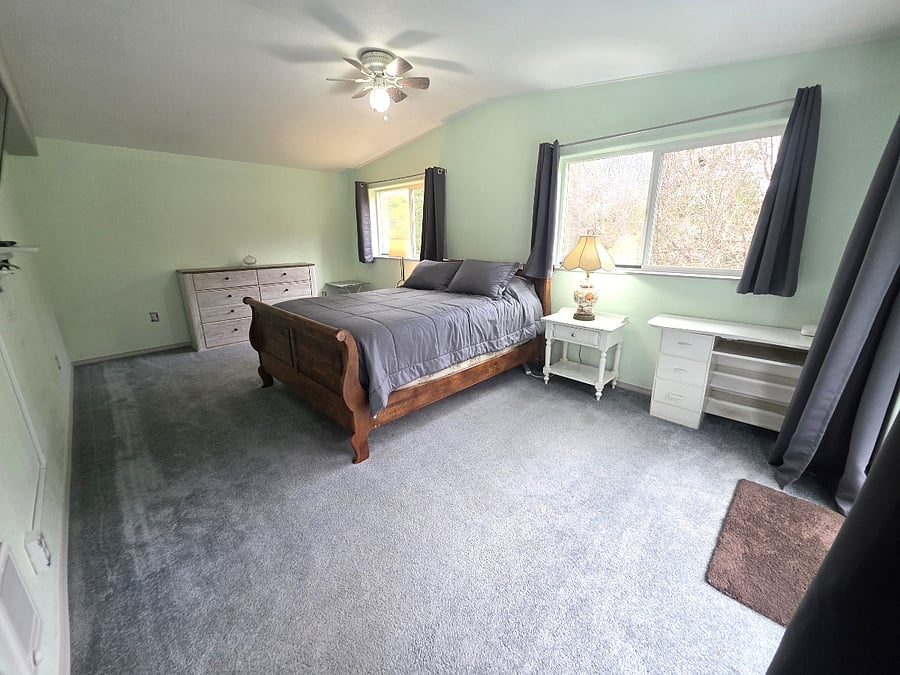 Primary bedroom with additional storage and workspace