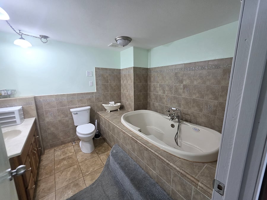 Spacious bathroom with jetted soaking tub