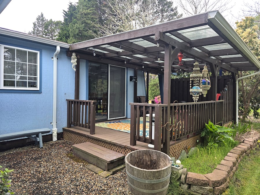 Additional view of covered deck with seating and outdoor space