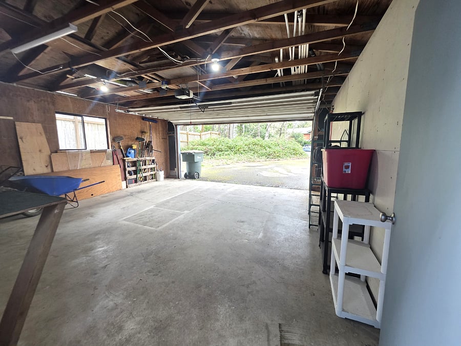 Large garage with storage and workspace potential