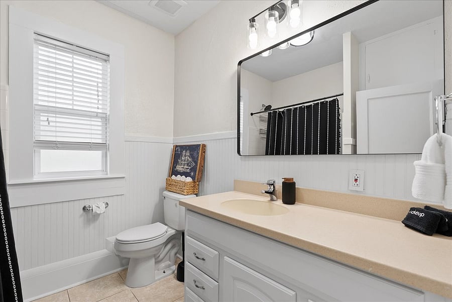 Shared full bathroom with shower and tub