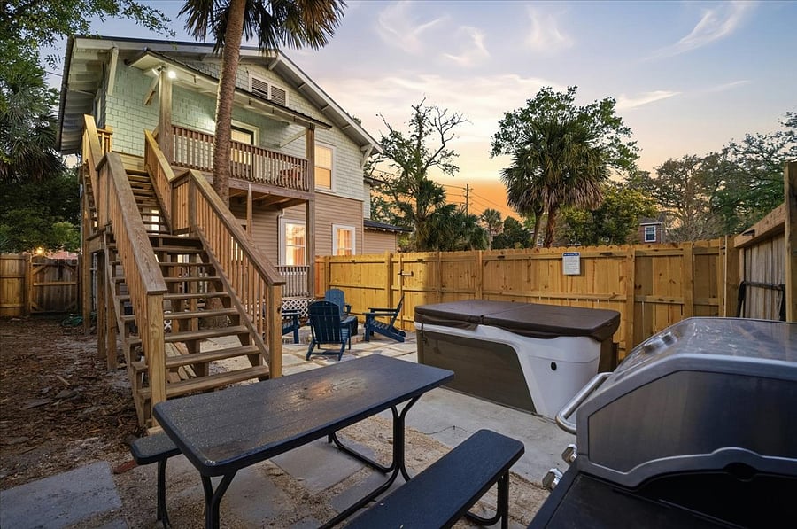 Fully fenced backyard with BBQ, firepit and spa.