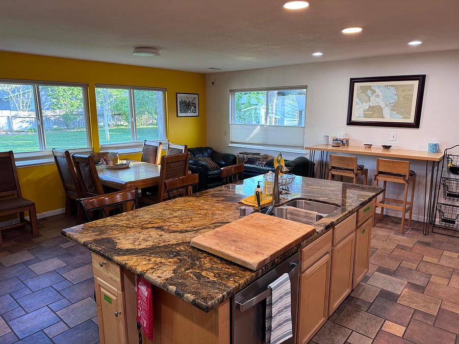Gourmet kitchen Island with ample seating and natural light
