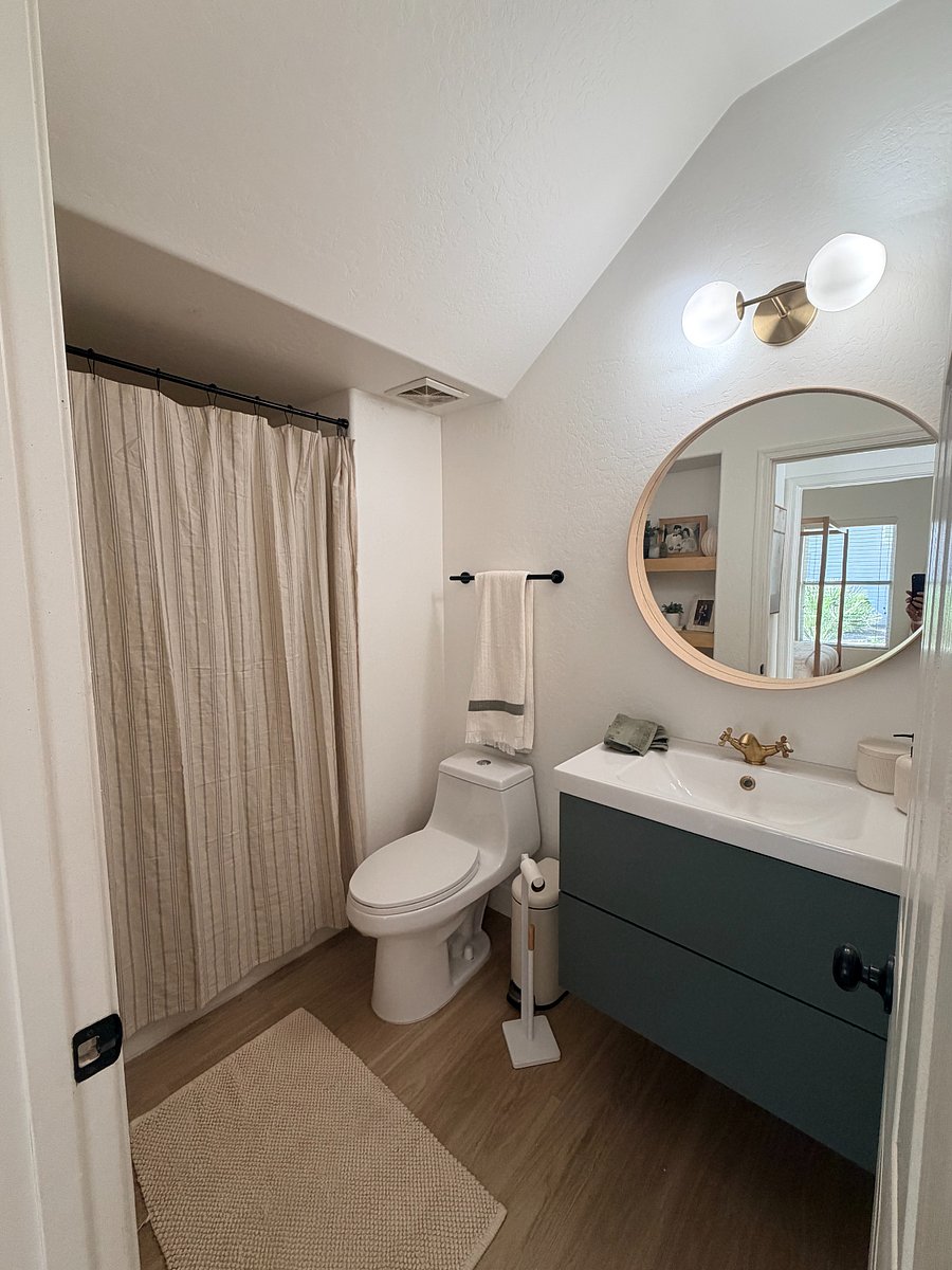 Clean, modern bathroom with warm finishes and a fresh, spa-like feel.