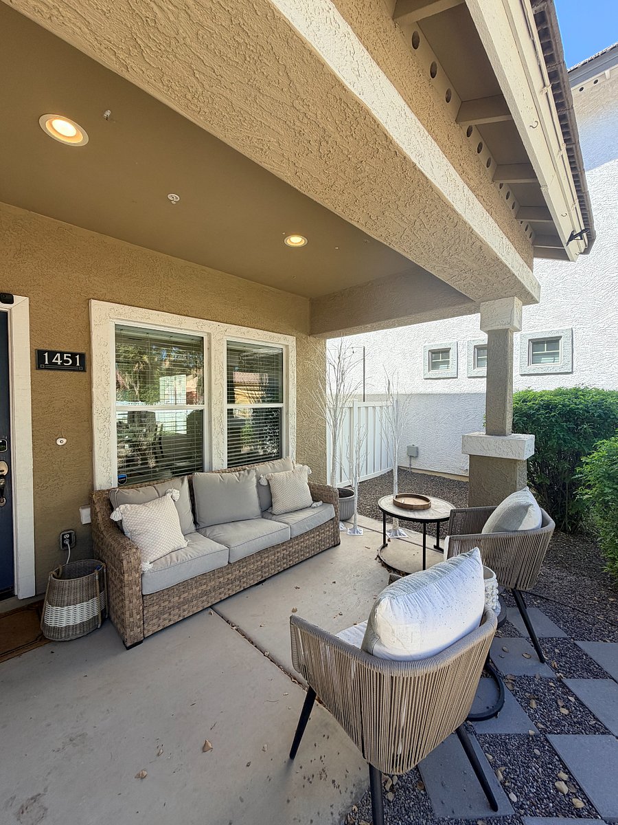 Welcoming front patio with comfortable seating perfect for enjoying Arizona evenings.