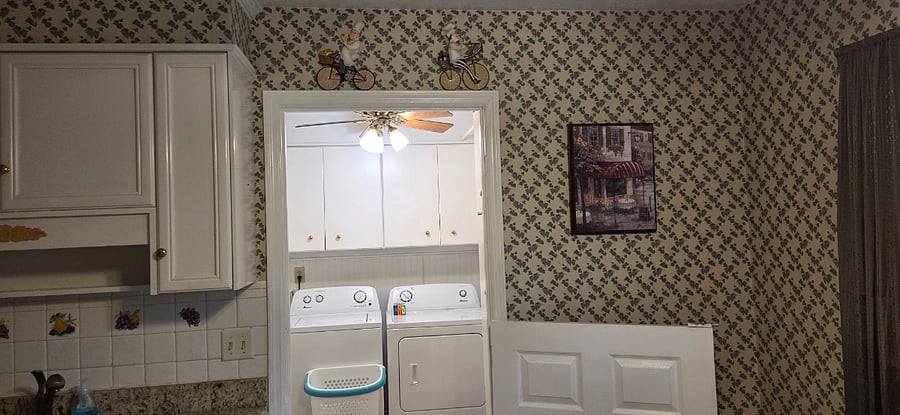 Laundry room. Washer/dryer, iron, ironing board