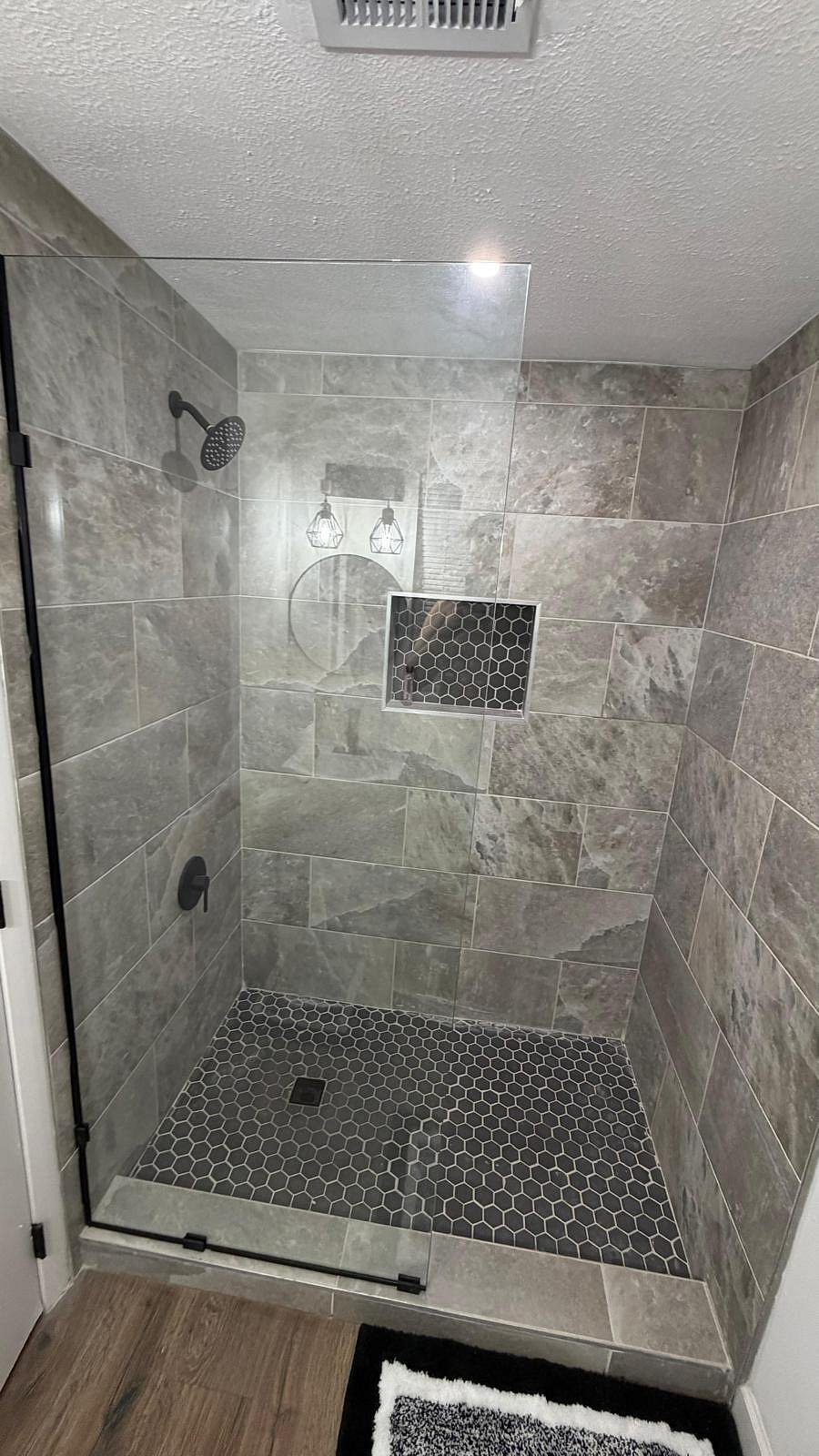 Shower with excellent water pressure, glass door. 
