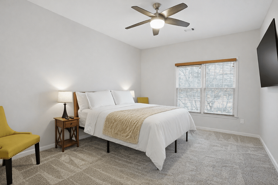 Comfortable bedroom with clean finishes and natural light.