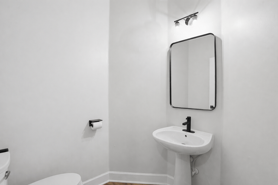 Convenient main-level guest bathroom for shared use.