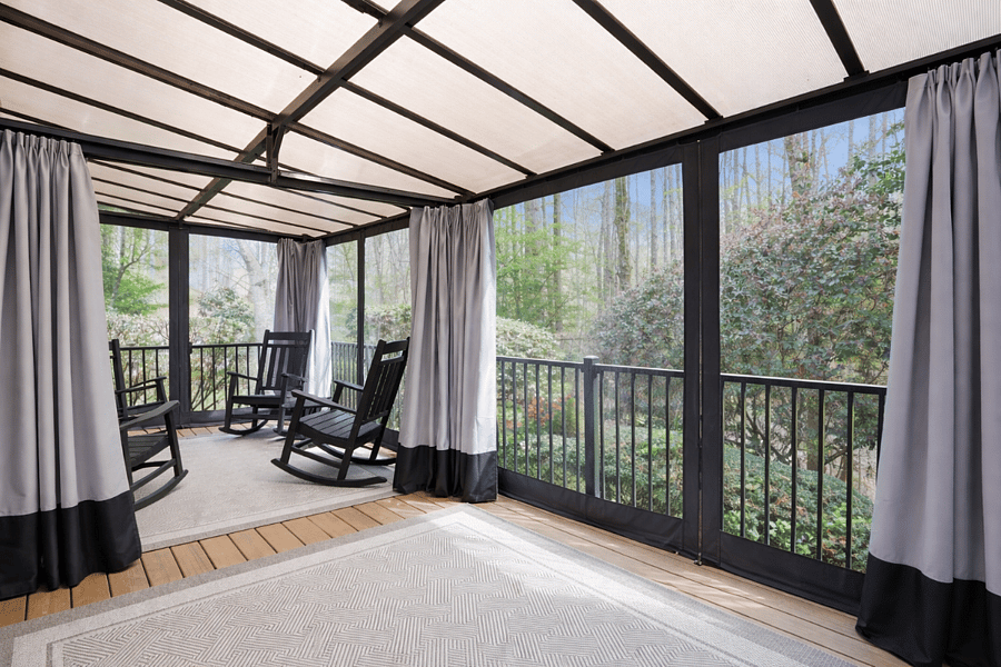 Covered outdoor patio perfect for relaxing or enjoying the surrounding green space.