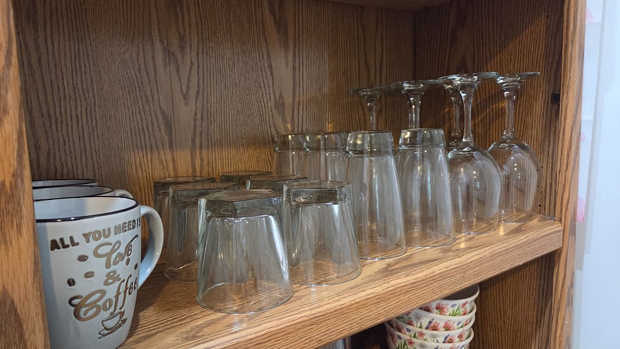 Kitchen essentials include glasses, plates and basic pots and pans.