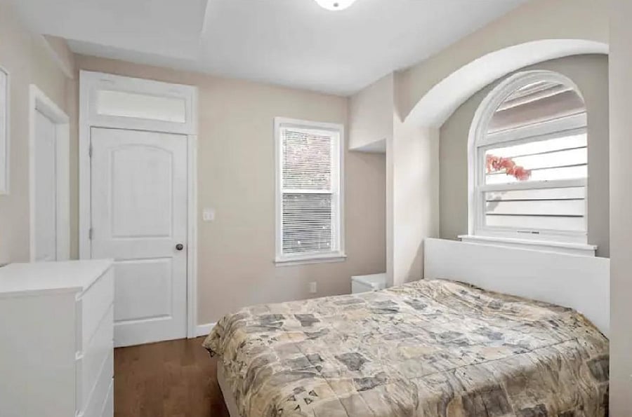 MAIN FLOOR BEDROOM #1 LEADING TO BACK SUNROOM