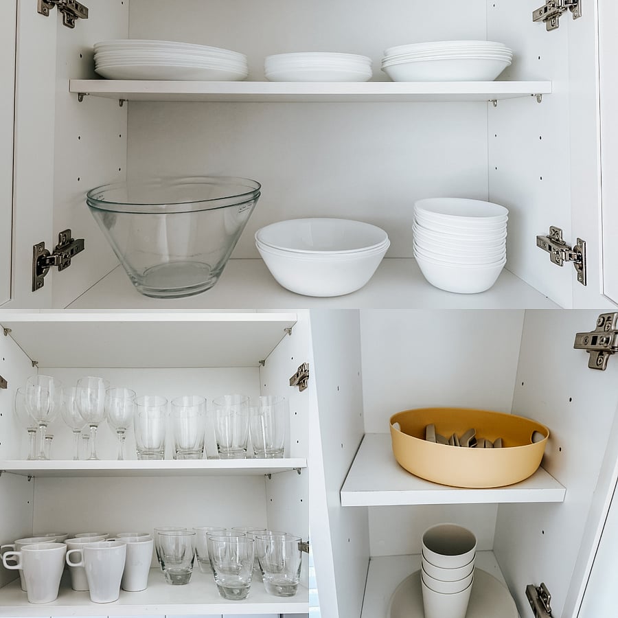 Fully Stocked Kitchen Cabinets
Clean, organized cabinets with plenty of white dinnerware, glass bowls, wine glasses, drinking glasses, and serving pieces  everything you need for daily meals and entertaining.