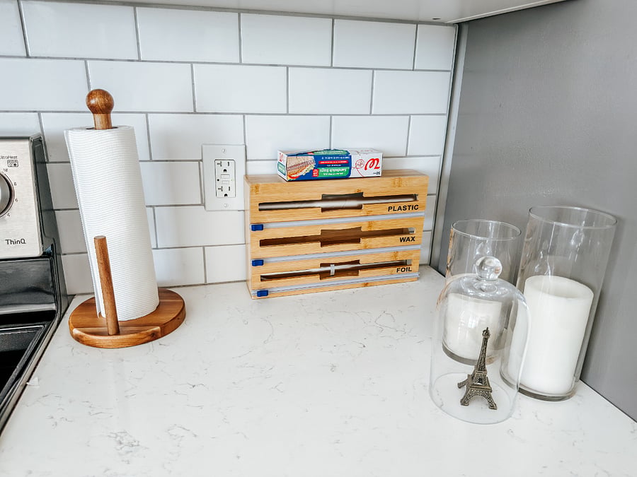 Kitchen Counter Organizer

Paper towel holder, bamboo wrap station (foil, plastic, wax paper), and glass candle holders.