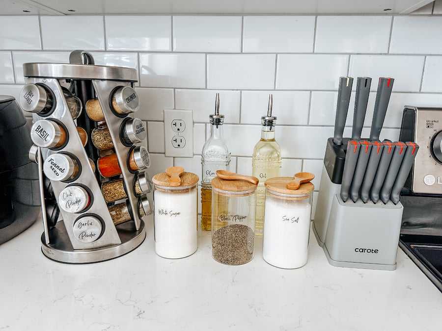  (Spice Rack & Canisters):

Fully Stocked Kitchen Counter
Convenient spice rack, labeled canisters (sugar, sea salt, black pepper), paper towel holder, and knife block  everything organized and ready to use.