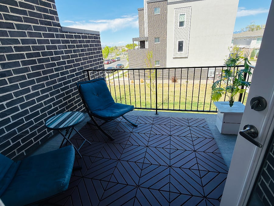Private Main-Level Balcony

Cozy outdoor balcony off the dining room featuring two comfortable teal chairs, a side table, and great neighborhood views. Ideal for morning coffee or unwinding after a shift.