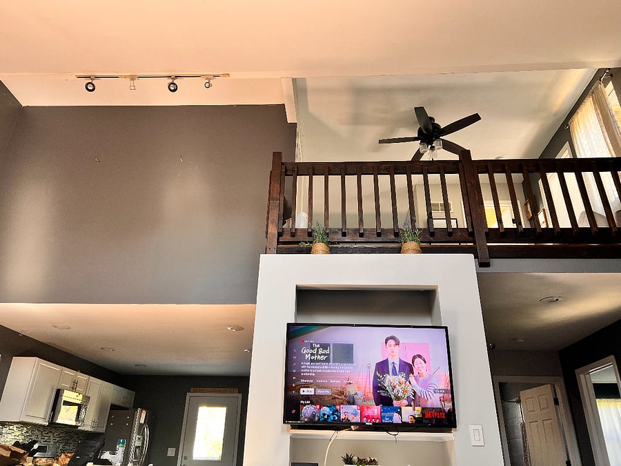 View of Kitchen and Upstairs from Living Room.