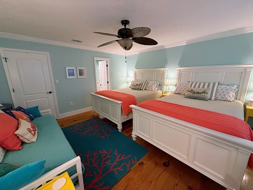 Upstairs bedroom with 2 queen beds, twin daybed and desk