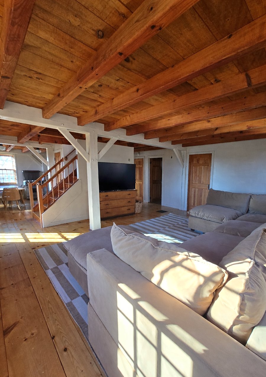Living room with sectional and TV
