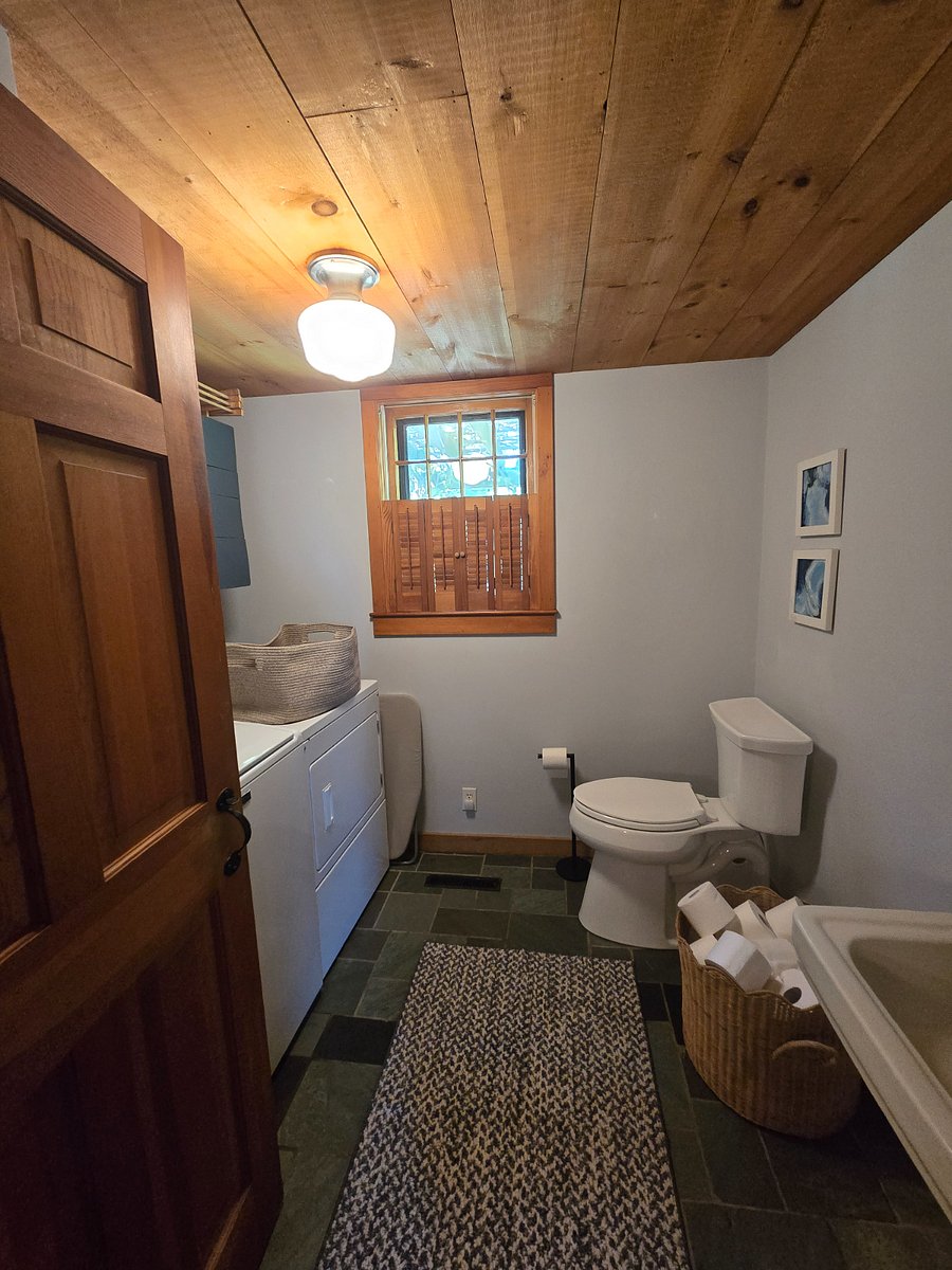 First floor half bath with commercial-size washer/dryer