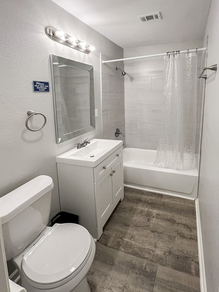Shared bathroom with tub and shower