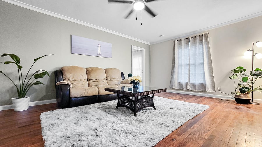 Cozy living room with a comfortable couch -- perfect for unwinding after a long day.