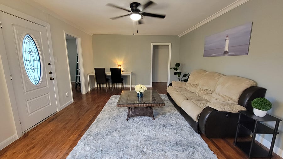 Cozy living room with a comfortable couch -- perfect for unwinding after a long day.