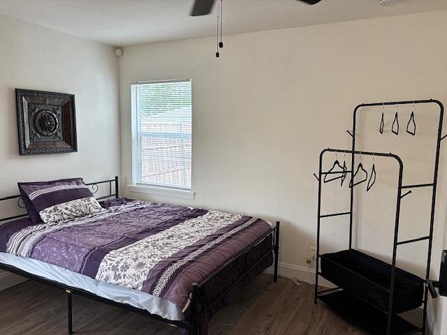 Room 2 with Queen Bed. Workspace, and clothes hanging system