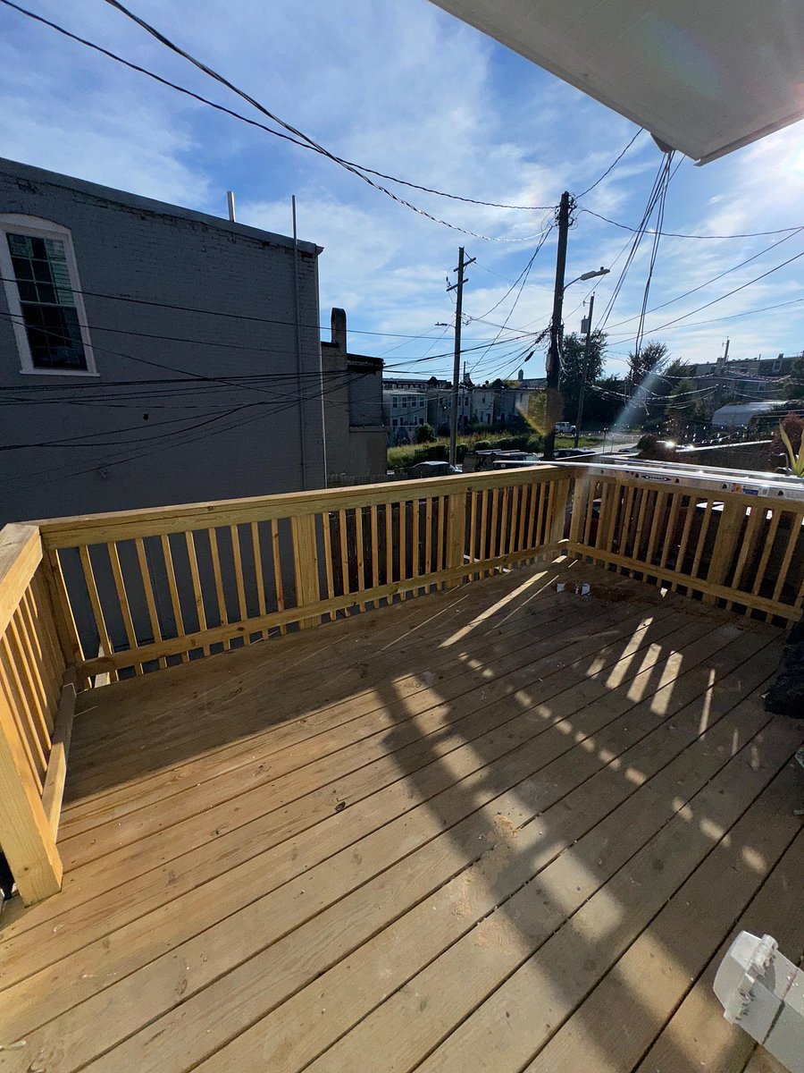 Deck at the rear of the house; Baltimore skyline at full display at night