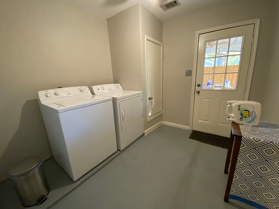 On-site laundry room, leading to the back covered patio.