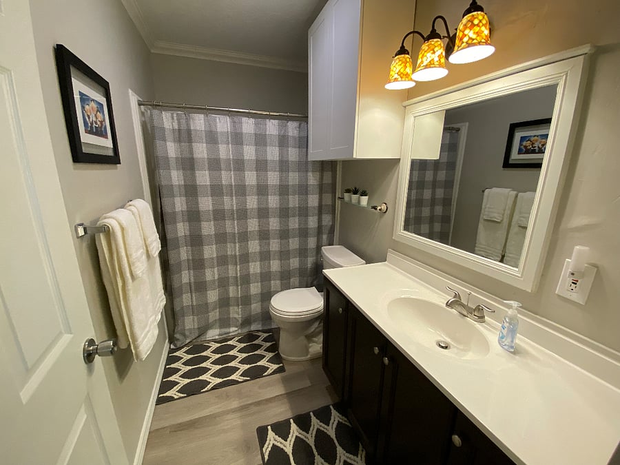 Guest bathroom, located near queen/kids' bedrooms.