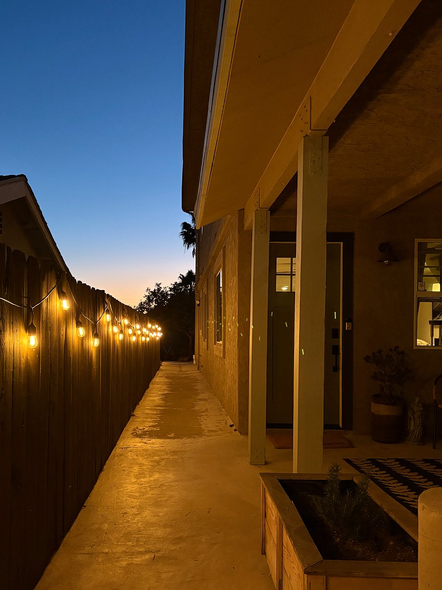 Illuminated passage from drive way to front door 