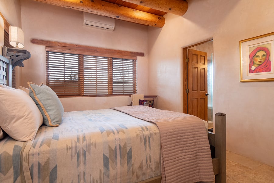Master bedroom with in-suite bathroom and walk-in closet