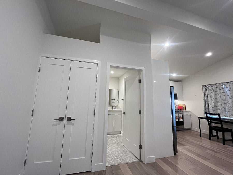 There's extra storage space above the double door closet.