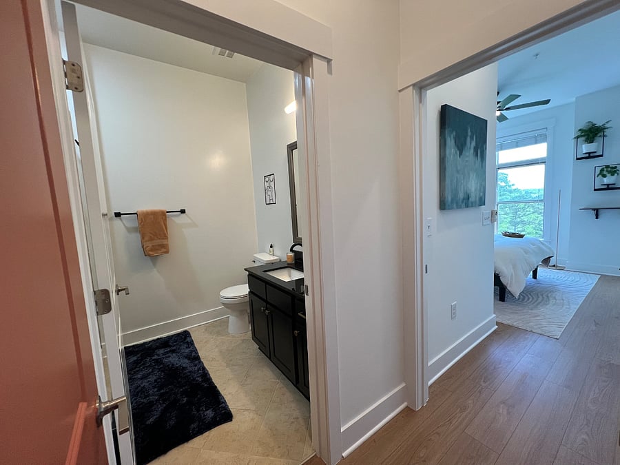 Private hallway connecting bedroom and en suite bathroom (separate from main living area).