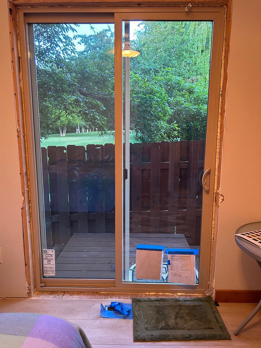 Room for lounging and kitchenette set up.
Patio door opens to small backyard space and public park.