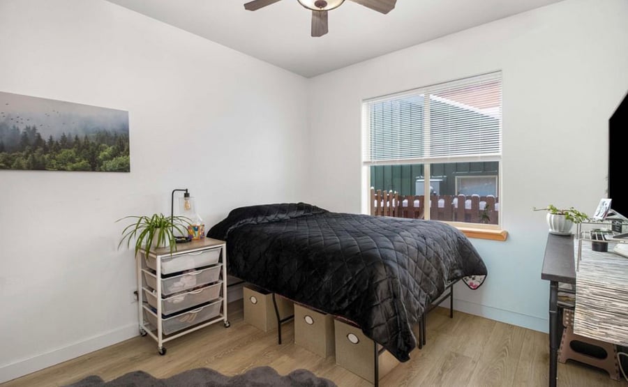 Room1 w queen bed, storage underneath, south facing window, & closet