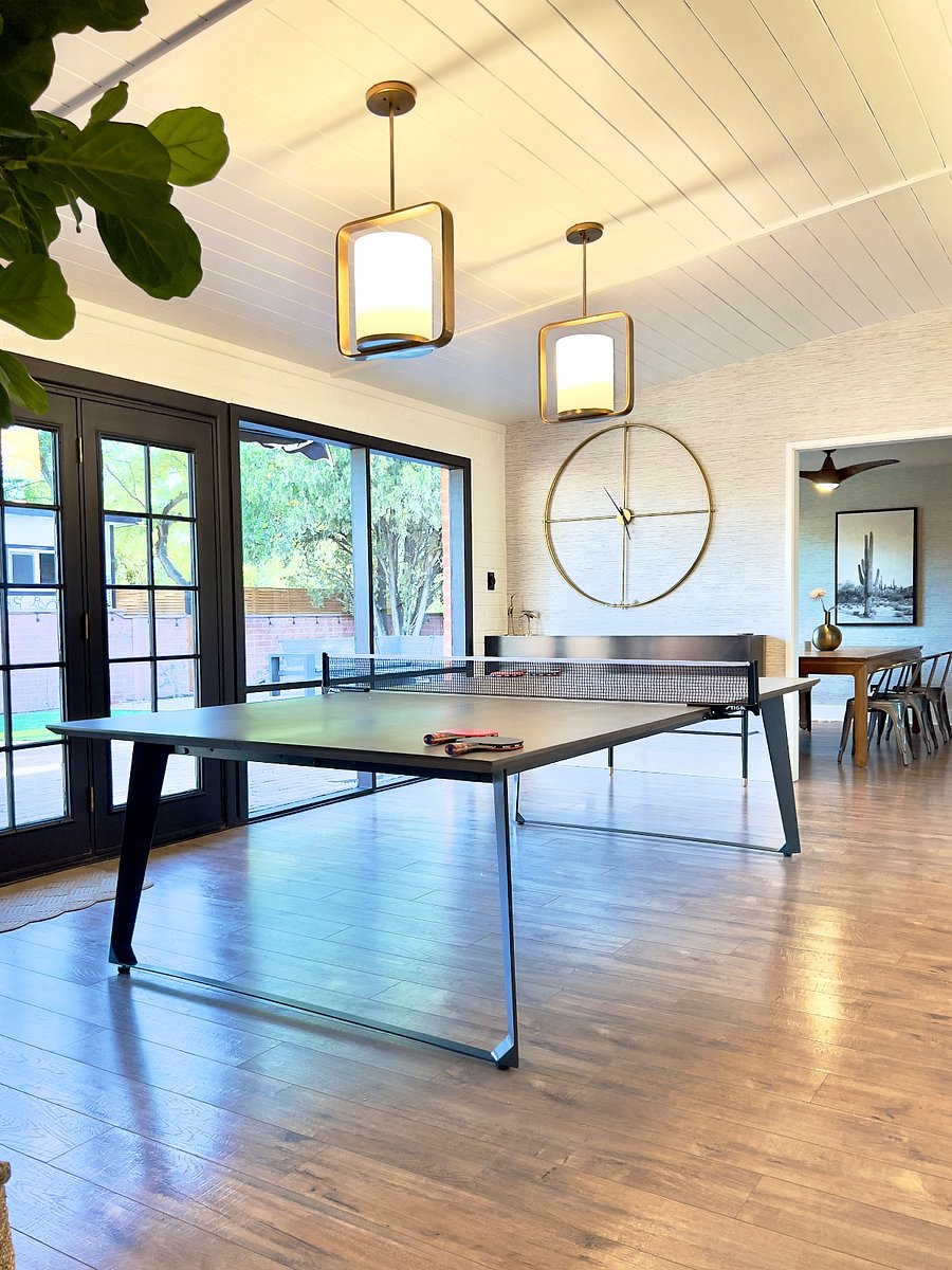 Have some fun in the game room with new stylish ping pong table, arcade and floor to ceiling windows overlooking the back yard.