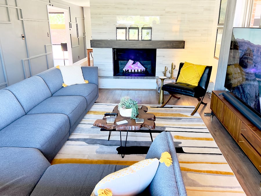 Plenty of seating in the family room with a 75 inch smart TV and Sonos sound system.