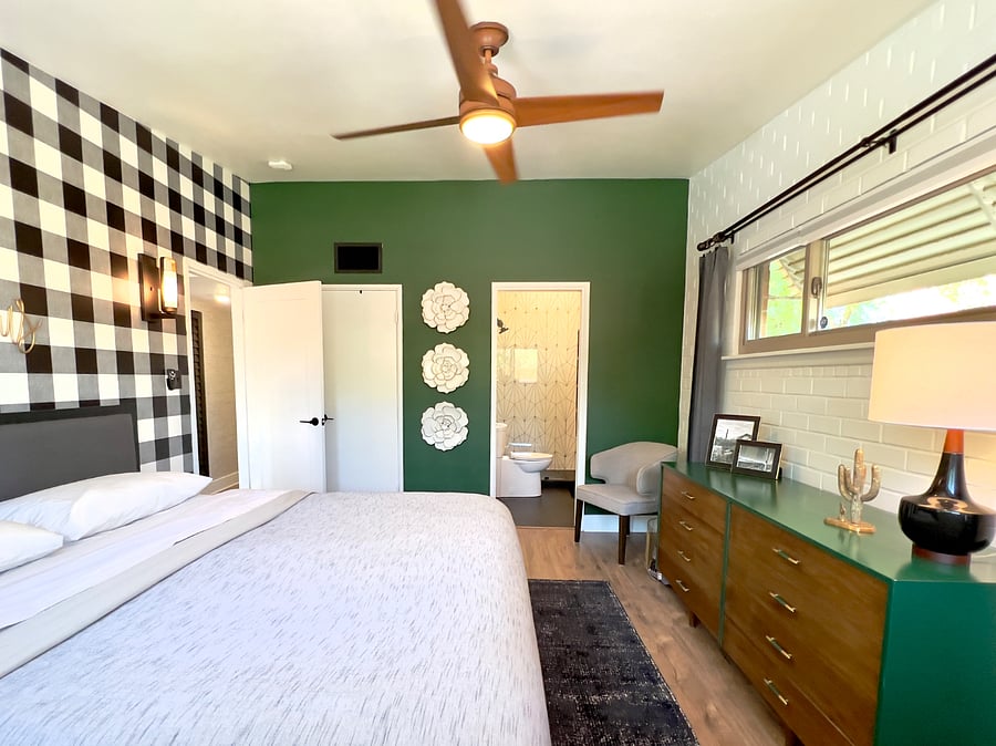 Two master suites with king beds, attached baths and tasteful decor.