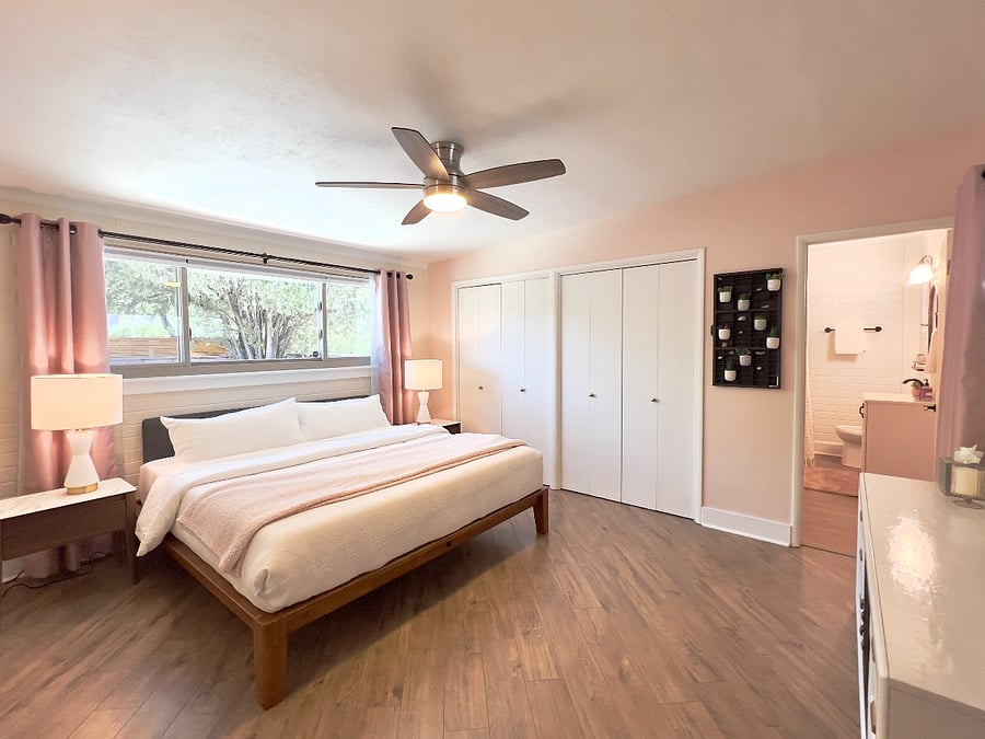 Two master suites with king beds, attached baths and tasteful decor.