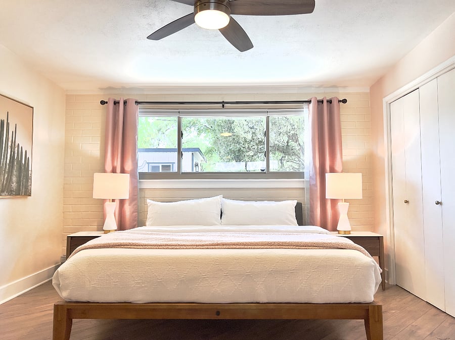 Two master suites with king beds, attached baths and tasteful decor.