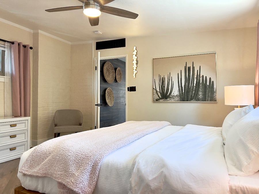 Two master suites with king beds, attached baths and tasteful decor.