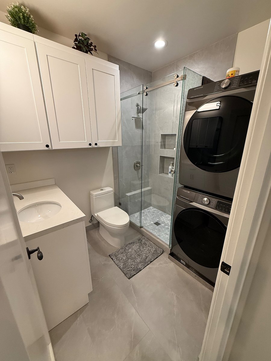 Full laundry in recently re-done bathroom. Shower and vanity.