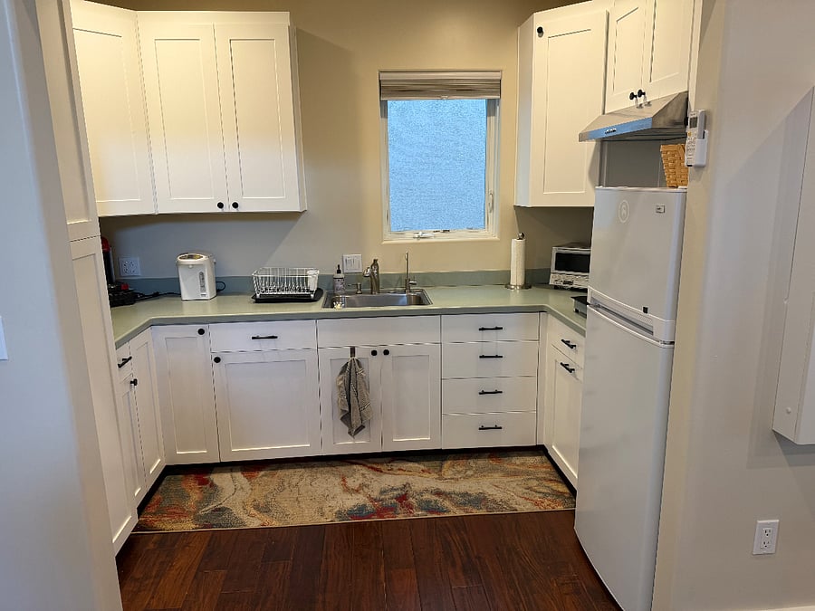 Kitchenette has stove top, toaster, microwave. Sink has disposal and water filtration.