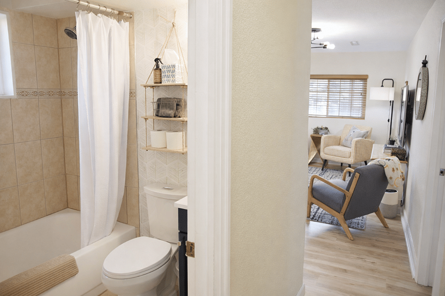 Family-ready bathroom featuring shampoo, conditioner, and body wash, conveniently located adjacent to both bedrooms. A step stool for little ones is available in the laundry room.