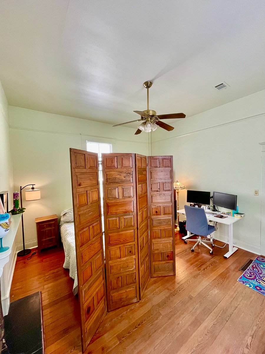 A large wooden privacy screen is available to offer more privacy for the guest room.