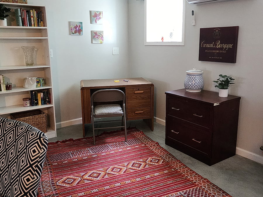 Office area with file storage and multiple overhead lights for a bright work environment.