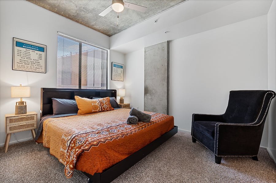 The bedroom serves as a true sanctuary, featuring a King-size bed with premium linens and a dedicated sitting area for quiet relaxation. Complete with an ensuite bathroom, this spacious suite offers the ultimate in privacy and comfort for a restful stay.