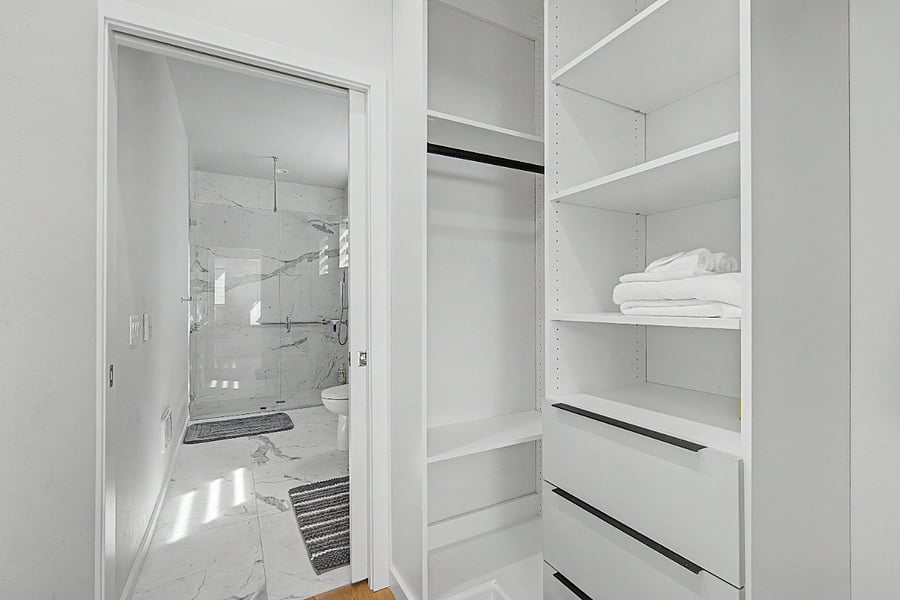Walk-in closet in primary bedroom
